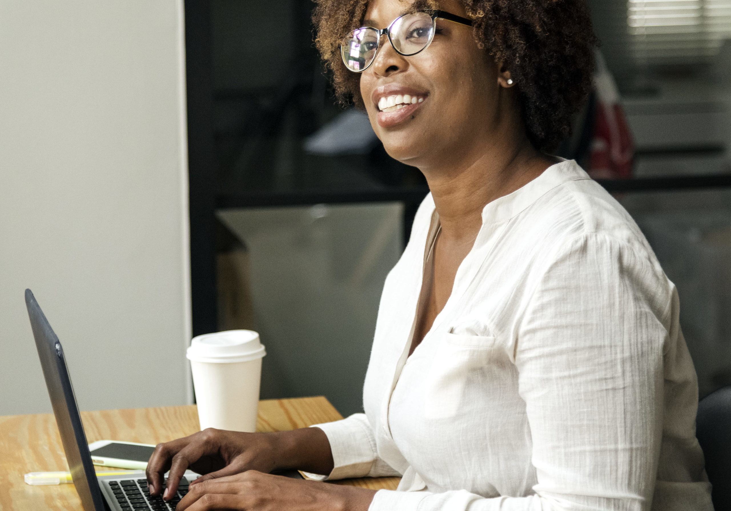 Woman using a laptop in a meeting room