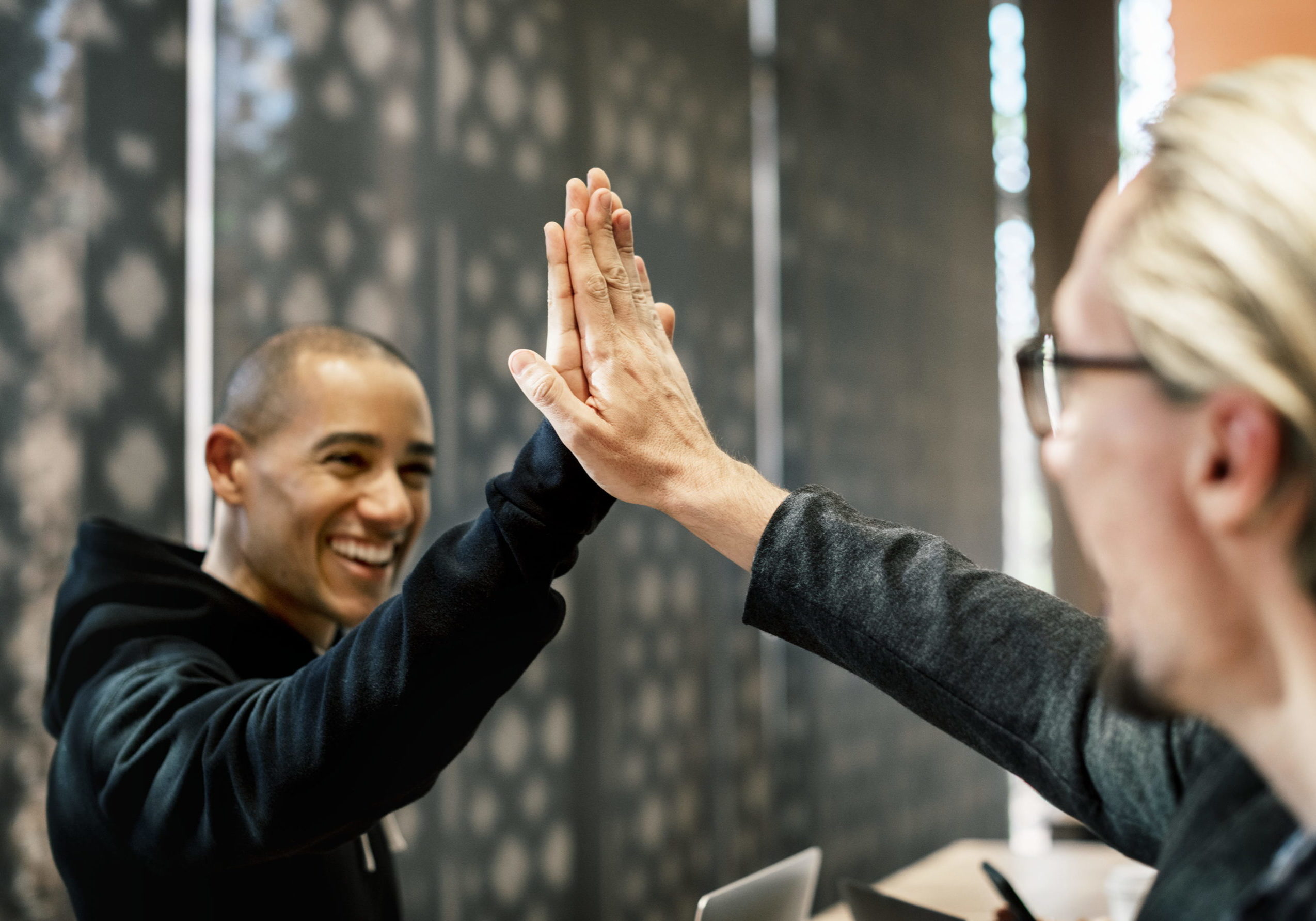 Colleagues giving a high five